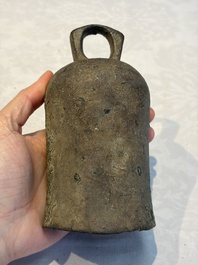 Seven various Chinese bronze and cast-iron bells, Han and later