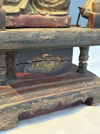 A Chinese gilt-lacquered wooden Bodhisattva and attendants on a throne, Qing