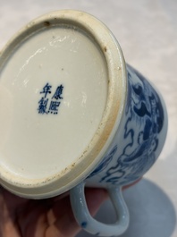 A Chinese blue and white 'Buddhist Lion' teapot, covered bowl and a saucer, various marks, 19th C.