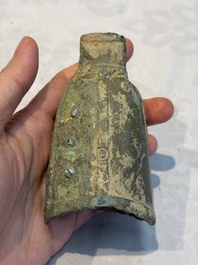 Seven various Chinese bronze and cast-iron bells, Han and later