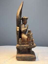 A Chinese gilt-lacquered wooden Bodhisattva and attendants on a throne, Qing