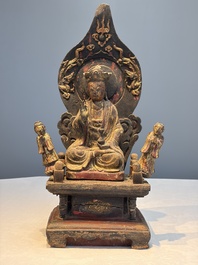 A Chinese gilt-lacquered wooden Bodhisattva and attendants on a throne, Qing