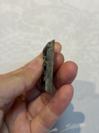 A small Chinese metal-alloy square mirror with relief design, Tang