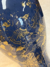 A Chinese gilt-decorated powder-blue-ground 'Phoenix among Blossoming Branches' vase, Qianlong