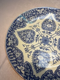 A large Chinese blue and white dish with floral design, Kangxi