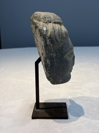 A Gandhara grey schist relief fragment of a Bodhisattva head, 3rd/4th C.