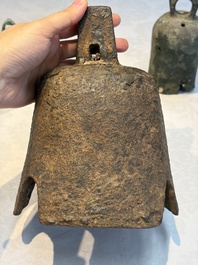 Seven various Chinese bronze and cast-iron bells, Han and later