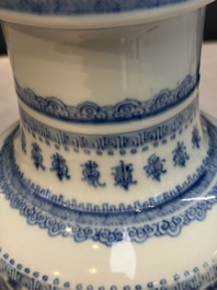 A Chinese blue and white rouleau vase with floral design, Kangxi