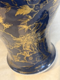 A Chinese gilt-decorated powder-blue-ground 'Phoenix among Blossoming Branches' vase, Qianlong