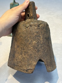 Seven various Chinese bronze and cast-iron bells, Han and later