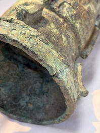 A Chinese archaic bronze ritual wine vessel with Taotie design, 'Zun 尊', Shang