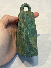 Seven various Chinese bronze and cast-iron bells, Han and later