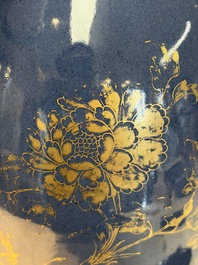 A Chinese gilt-decorated powder-blue-ground 'Phoenix among Blossoming Branches' vase, Qianlong