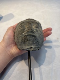 A Gandhara grey schist relief fragment of a Bodhisattva head, 3rd/4th C.
