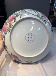 A Chinese famille rose 'Nine Peaches' dish on wooden stand, Yongzheng mark, 20th C.