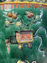 A Chinese famille rose green-ground 'Antiquities' fish bowl or jardini&egrave;re with applied relief design, 19th C.