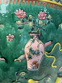 A Chinese famille rose green-ground 'Antiquities' fish bowl or jardini&egrave;re with applied relief design, 19th C.