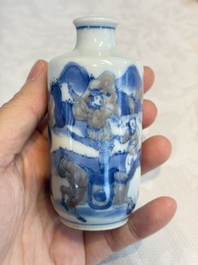 A Chinese blue, white and copper-red snuff bottle with narrative design, 19th C.