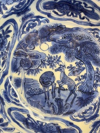 A pair of Chinese blue and white 'Klapmuts' bowls with deer design, Wanli