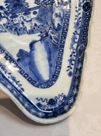 A pair of Chinese blue and white handled sauce boats and stands with pagodas along a river, Qianlong