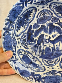 A pair of Chinese blue and white 'Klapmuts' bowls with deer design, Wanli