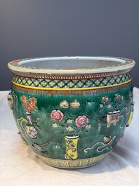 A Chinese famille rose green-ground 'Antiquities' fish bowl or jardini&egrave;re with applied relief design, 19th C.