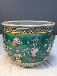A Chinese famille rose green-ground 'Antiquities' fish bowl or jardini&egrave;re with applied relief design, 19th C.