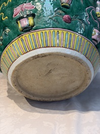A Chinese famille rose green-ground 'Antiquities' fish bowl or jardini&egrave;re with applied relief design, 19th C.
