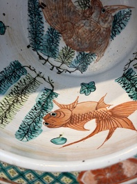 A Chinese famille rose green-ground 'Antiquities' fish bowl or jardini&egrave;re with applied relief design, 19th C.