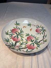 A Chinese famille rose 'Nine Peaches' dish on wooden stand, Yongzheng mark, 20th C.