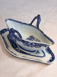 A pair of Chinese blue and white handled sauce boats and stands with pagodas along a river, Qianlong