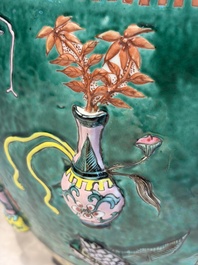 A Chinese famille rose green-ground 'Antiquities' fish bowl or jardini&egrave;re with applied relief design, 19th C.