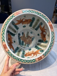 A Chinese famille rose green-ground 'Antiquities' fish bowl or jardini&egrave;re with applied relief design, 19th C.