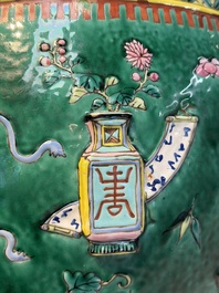 A Chinese famille rose green-ground 'Antiquities' fish bowl or jardini&egrave;re with applied relief design, 19th C.