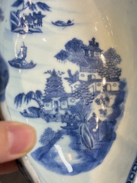 A pair of Chinese blue and white handled sauce boats and stands with pagodas along a river, Qianlong