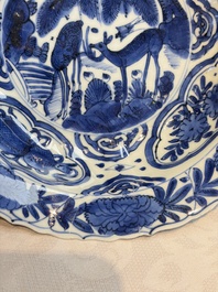 A pair of Chinese blue and white 'Klapmuts' bowls with deer design, Wanli