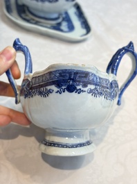 A pair of Chinese blue and white handled sauce boats and stands with pagodas along a river, Qianlong
