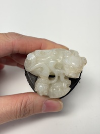 A Chinese carved jade 'Buddhist Lions' group, 19th C.