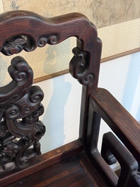 A pair of Chinese carved hongmu armchairs, 19th C.
