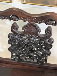 A pair of Chinese carved hongmu armchairs, 19th C.