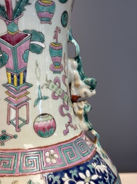 A pair of Chinese famille rose 'Antiquities' vases, 19th C.