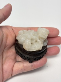 A Chinese carved jade 'Buddhist Lions' group, 19th C.