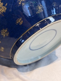 A large Chinese iron-red and gilt-decorated powder-blue-ground bowl with narrative design, 19th C.