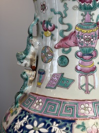A pair of Chinese famille rose 'Antiquities' vases, 19th C.