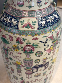 A pair of Chinese famille rose 'Antiquities' vases, 19th C.