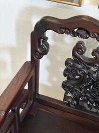 A pair of Chinese carved hongmu armchairs, 19th C.