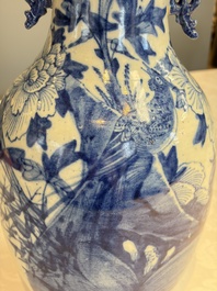 Two Chinese blue and white celadon-ground vases and a blue and white vase, on wooden stands, 19th C.