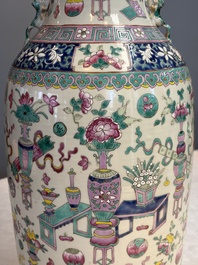 A pair of Chinese famille rose 'Antiquities' vases, 19th C.