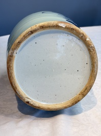 Two Chinese blue and white celadon-ground vases and a blue and white vase, on wooden stands, 19th C.