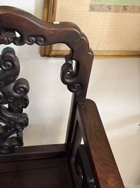 A pair of Chinese carved hongmu armchairs, 19th C.